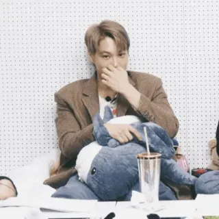 🥂 person, man, brown blazer, stuffed animal, sitting, indoors telegram sticker