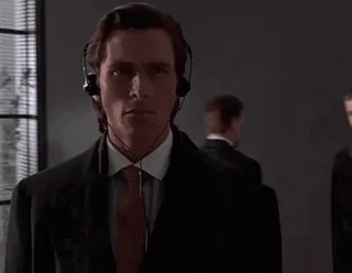 🌟 Patrick Bateman American Psycho Patrick Bateman, American Psycho, Christian Bale, businessman, serious, film, movie, headphones whatsapp sticker