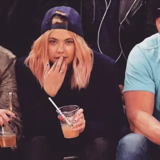 🦄 woman, celebrity, baseball cap, drink, person, sitting telegram sticker