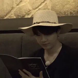 😐 man, hat, reading, indoors, person telegram sticker