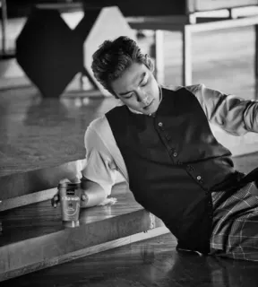 🏴 man, sitting, indoors, formal wear, photography, black and white telegram sticker
