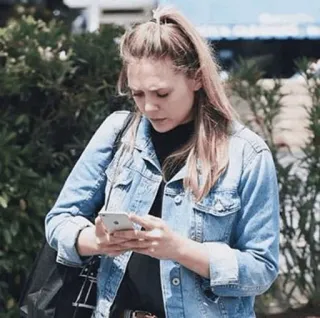 ◾️ woman, denim jacket, phone, ponytail, casual, person, adult telegram sticker