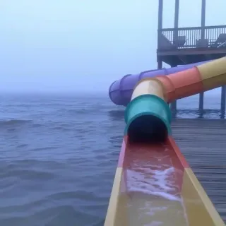 👁 waterslide, water, ocean, fog, pier, dock, amusement park telegram sticker