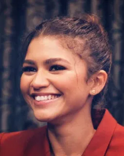 🤣 Zendaya attrice, celebrità, donna, sorriso, blazer rosso telegram sticker