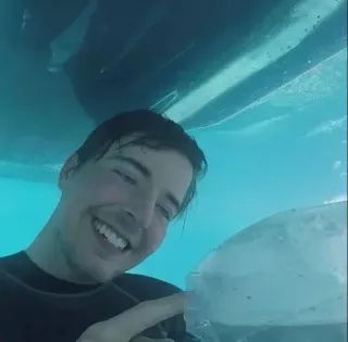 🌟 mrbeast, swimming, underwater, smiling, man, diving telegram sticker