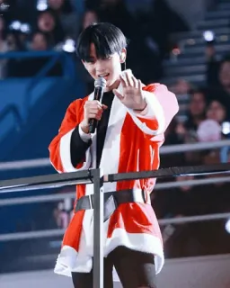 🌦 person, microphone, stage, santa suit, singing, performance telegram sticker