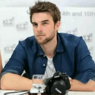 📎 man, actor, portrait, sitting, table, camera telegram sticker