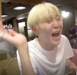 🤣 person, laughing, blond hair, white t-shirt, indoor, open mouth telegram sticker