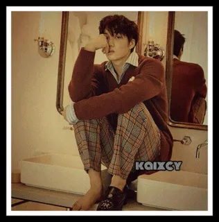 😕 KAIXCY man, seated, indoors, fashion, casual telegram sticker