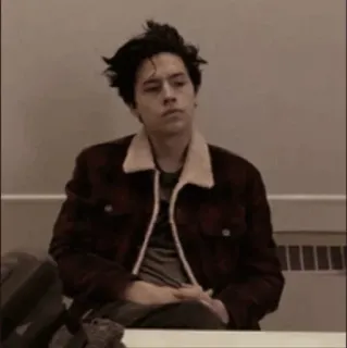😑 Cole Sprouse aktor, siedzący, poważny, portret telegram sticker