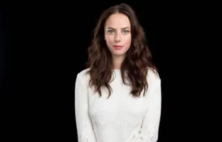 🦋 woman, portrait, brunette, white sweater, black background, serious, female telegram sticker