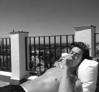 ◽️ man, shirtless, drinking, laying, relaxation, sunbathing whatsapp sticker