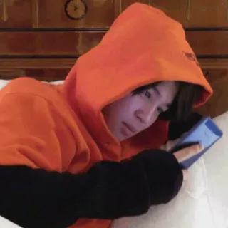 🍪 person, hoodie, phone, casual, relaxing, indoors whatsapp sticker