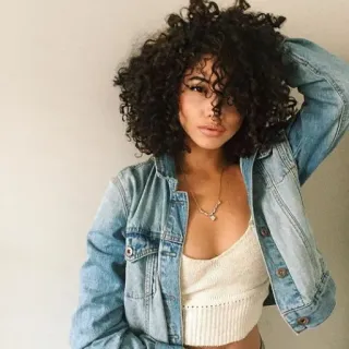 😌 woman, curly hair, denim jacket, portrait, model telegram sticker