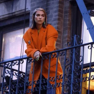 🥂 Dua Lipa Дуа Липа, певица, знаменитость, оранжевое пальто, балкон, женщина telegram sticker