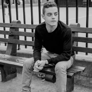 💭 Rami Malek Rami Malek, actor, celebrity, black and white, portrait, man, bench telegram sticker