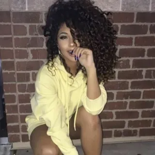 👀 woman, portrait, curly hair, yellow hoodie telegram sticker