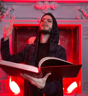 📖 homme, capuche, livre, rouge, cheminée, lecture whatsapp sticker