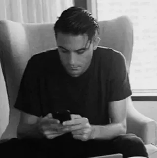 💰 man, sitting, chair, indoors, black and white telegram sticker