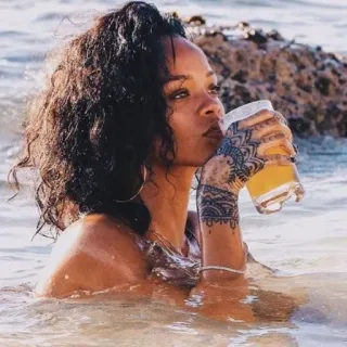 💸 Rihanna woman, singer, celebrity, ocean, drinking, water, beach telegram sticker