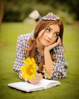 😶 girl, book, sunflower, grass, lying down, outdoors telegram sticker