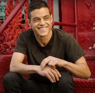 😂 Rami Malek actor, portrait, smile, celebrity, man, stairs telegram sticker