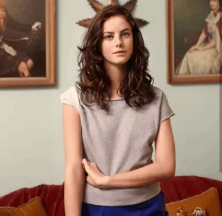 🦋 woman, portrait, brunette, gray shirt, blue skirt, artwork, indoors telegram sticker