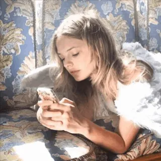 🌿 angel, wings, woman, phone, couch, blonde, indoor telegram sticker