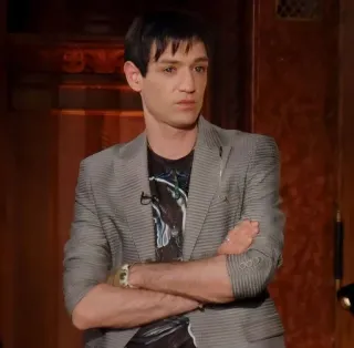 🌟 Geno Martino Project Runway man, arms crossed, fashion designer, serious, reality television, gaze telegram sticker