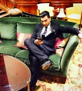 🌀 man, suit, couch, indoors, luxury, sitting, phone telegram sticker