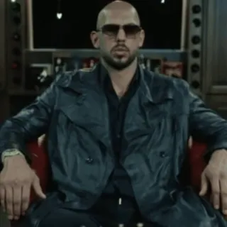 🌟 96f45c63 Andrew Tate người đàn ông, kính râm, ngồi, áo da telegram sticker