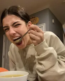 🙈 0a8a02fa Charli D'Amelio woman, eating, spoon, food, portrait, tasty whatsapp sticker