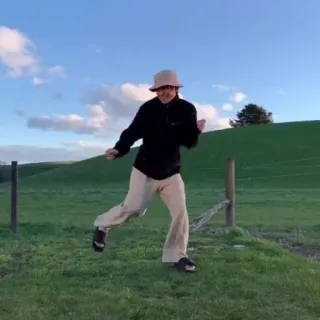 🤠 9db0ca7e tanzen, feld, person, draußen, kleidung, bucket hat, natur telegram sticker