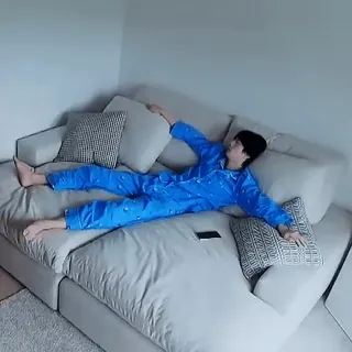 😐 42a5c49a person, couch, pajamas, relaxation, living room, indoors telegram sticker