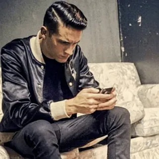 💰 3dae2f99 man, jacket, sofa, person, looking at phone, sitting, style telegram sticker