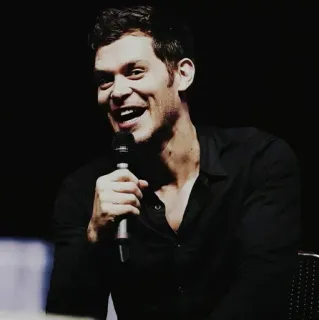 🍂 9ab41a7c Klaus Mikaelson The Vampire Diaries man, microphone, black shirt, portrait, actor, tv show telegram sticker