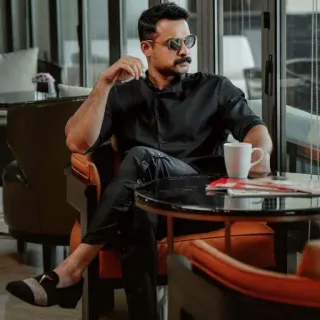 😘 b800c337 man, sunglasses, seated, coffee, formal wear, indoors, stylish telegram sticker