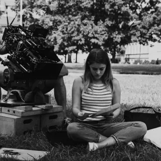 🕊 d0ddae67 woman, grass, sitting, actress, camera, outdoors telegram sticker