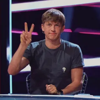 ✌️ fbe5a95e person, peace sign, casual wear, television studio, sitting telegram sticker